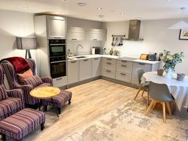 A kitchen with a table and chairs at Cottage - Sleeps 2 - Garden in Coleford