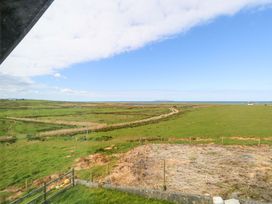 A landscape view of grassland and sea at Ocean View in Westport