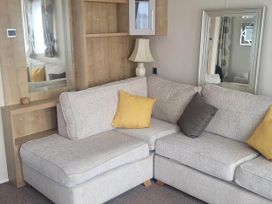 A living room with a grey sofa and lamp at Beachside Lodge - Sleeps 6 - Pets ok - Parking in Heysham