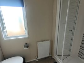 A bathroom with a shower and toilet at Beachside Lodge - Sleeps 6 - Pets ok - Parking Heysham
