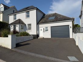 A house with a garage and driveway at Lorrell in Salcombe