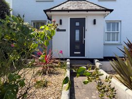An entrance with a door and plants at Lorrell in Salcombe