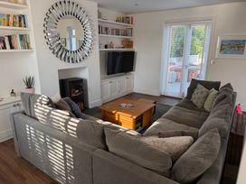 A living room with a sofa and coffee table at Lorrell in Salcombe