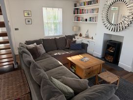 A living room with a sofa and coffee table at Lorrell in Salcombe