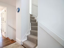 A staircase in a hallway at Lorrell in Salcombe