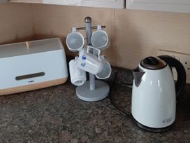 A kitchen with a kettle and cup holder at Taid's Retreat Silversands Cove beach lossiemouth