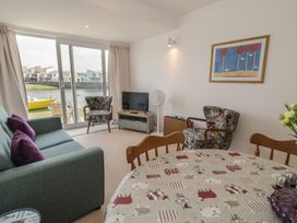 A living room with furniture and a view at Harbourside in Porthmadog