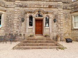 A front entrance with a door and steps at Rochester Apartment in Orton