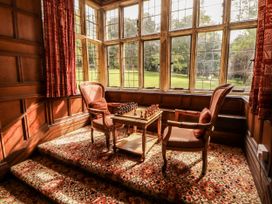A snug with a chess set and two armchairs at Rochester Apartment in Orton