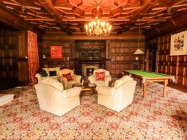 A living room with a pool table and seating area at Rochester Apartment in Orton
