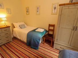 A bedroom with a bed and nightstand at Rochester Apartment in Orton