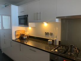 A kitchen with countertops and cooking appliances at Anchors Rest in St. Ives