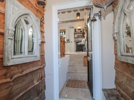 An entryway with stairs leading to a kitchen at 7 The Cedars Wotton-Under-Edge