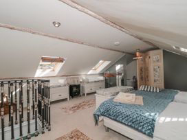 A bedroom with a bed and skylights at 7 The Cedars in Wotton-Under-Edge
