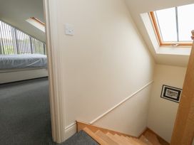 A staircase leading to a bedroom at Millmead House Annex Portesham