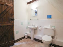 A bathroom with a sink and toilet at Cider House in Hawkchurch