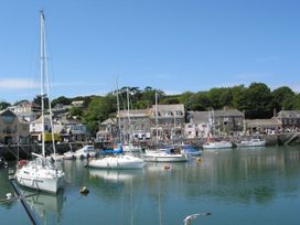 A harbor with boats and buildings at Mays Cottage Wadebridge