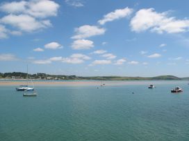 A scenic view of water with boats at Mays Cottage in Wadebridge