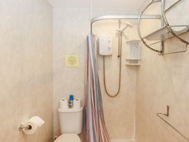 A bathroom with a shower and toilet at Apartment 4 in Torquay