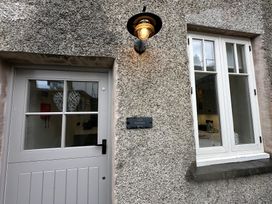 The entrance of La'al Kirkstone Brow in Ambleside featuring a door and window
