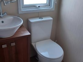 A bathroom with a wash basin and a toilet at B2 in Lossiemouth