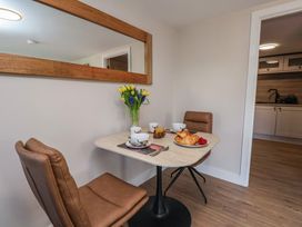 A dining room with a table set for breakfast at Little Holm Garth 