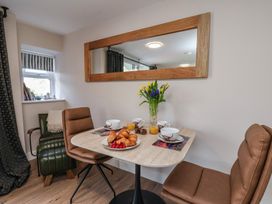 A dining room with a table set for breakfast at Little Holm Garth 