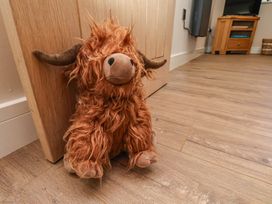 A plush toy in front of a door at Little Holm Garth in 