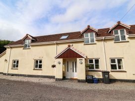 An outdoor view of a house with windows and a front door at The Station House Blackmoor Gate near Parracombe