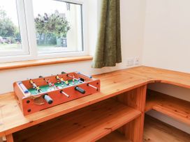 A foosball table on a wooden shelf in a snug at The Station House Blackmoor Gate near Parracombe