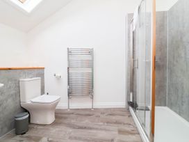 A bathroom featuring a shower and toilet at The Station House near Blackmoor Gate Parracombe