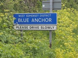 A road sign indicating Blue Anchor and urging drivers to drive slowly
