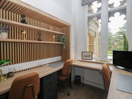 An office with desks and shelves at Brettargh Holt Mansion near Levens