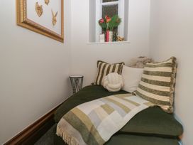 A snug with a couch and decorative pillows at Brettargh Holt Mansion near Levens