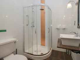 A bathroom with a shower and a sink at Brettargh Holt Mansion near Levens
