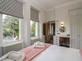 A bedroom with a bed and desk at Brettargh Holt Mansion near Levens