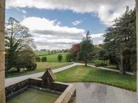 An outdoor area with trees and a driveway at Brettargh Holt Mansion near Levens