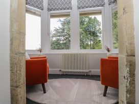 A snug with two chairs and a radiator at Brettargh Holt Mansion near Levens