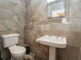A bathroom with a toilet and sink at Brettargh Holt Mansion near Levens