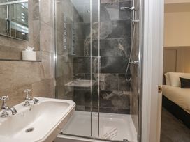 A bathroom featuring a sink and shower at Brettargh Holt Mansion near Levens