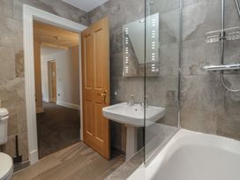 A bathroom with a sink and a bathtub at Brettargh Holt Mansion near Levens