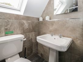 A bathroom with toilet and washbasin at Brettargh Holt Mansion near Levens