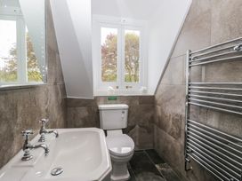 A bathroom featuring a toilet and sink at Brettargh Holt Mansion near Levens