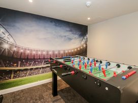 A foosball table in a game room at Brettargh Holt Mansion near Levens