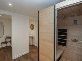 A spa area with a sauna and washbasin at Brettargh Holt Mansion near Levens