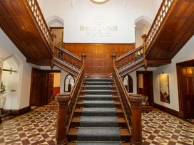A staircase in the hallway at Brettargh Holt Mansion near Sizergh, Cumbria