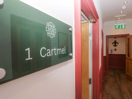 A hallway with a sign indicating room 1 Cartmel at Brettargh Holt Mansion Sleeping 48 near Sizergh, Cumbria