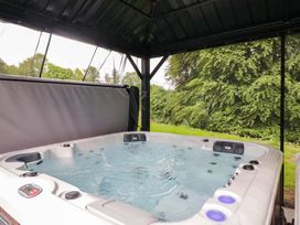 A hot tub in an outdoor area at Brettargh Holt Mansion Sleeping 48 near Sizergh, Cumbria