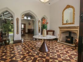 A lobby with a decorative table and chairs at Brettargh Holt Mansion 32 near Levens