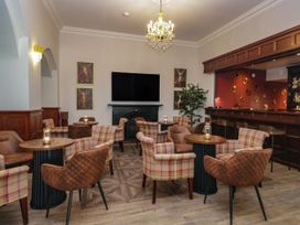A bar with chairs and tables at Brettargh Holt Mansion 32 near Levens